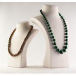 NECKLACE OF GRADUATED ROUND MALACHITE BEADS, 22IN (55.8cm) long and a TWISTED TRIPLE STRAND NECKLACE