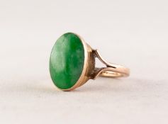 9ct GOLD RING collet set with an oval jade green stone, 3.8gms, ring size K