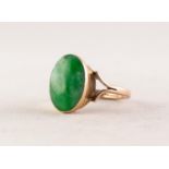 9ct GOLD RING collet set with an oval jade green stone, 3.8gms, ring size K