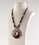 FOREIGN SILVER LARGE PENDANT framing and orange and white banded agate hollow circular stone