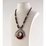 FOREIGN SILVER LARGE PENDANT framing and orange and white banded agate hollow circular stone