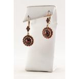 PAIR OF CONTINENTAL GOLD COLOURED METAL AND GARNET CLUSTER DROP EARRINGS