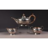 GEORGE V THREE PIECE BACHELORS SILVER TEA SET BY MAPPIN & WEBB, of squat form with circular bases,