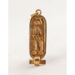 EGYPTIAN GOLD COLOURED METAL ROUNDED OBLONG PENDANT, cave relievo with hieroglypyhs, 1 1/4in (3.1cm)
