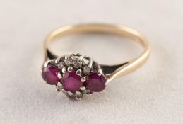 9ct GOLD RING set with a row of three rubies and eight tiny diamonds, 2.1 gms, ring size M