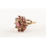9ct GOLD AND GARNET OVAL CLUSTER RING set with a centre oval garnet and surround of ten small