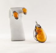 W. KRUK CRAFT SILVER AND BUTTERSCOTCH AMBER LARGE TEAR SHAPED PENDANT and a PAIR OF OVAL