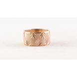9ct GOLD BROAD WEDDING RING, the engine turned ground bright cut engraved with leaf motifs, London