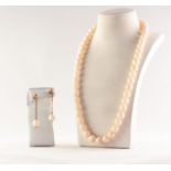 SINGLE STRAND NECKLACE OF 51 UNIFORM PALE PINK CORAL BEADS, 20in (50.8cm) long and the PAIR OF