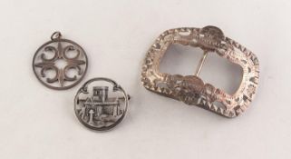 SILVER COLOURED METAL PIERCED OBLONG BUCKLE, 3in (7.6cm); a SILVER CIRCULAR IONA CHURCH BROOCH and a