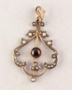 GOLD COLOURED METAL OPENWORK PENDANT set with a cabochon circular centre garnet and with seed