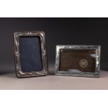 MODERN EMBOSSED SILVER FRONTED DESK TOP PHOTOGRAPH FRAME, oblong with easel support to the blue
