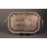 ELECTROPLATED CANTED OBLONG TWO HANDLED TEA TRAY, the centre chased with thistles and the conforming