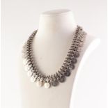 VICTORIAN SILVER COLOURED METAL CHAIN LINK NECKLACE with a fringe of 33 star embossed discs, large