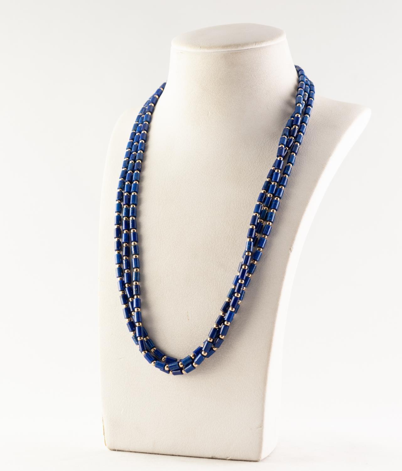 TRIPLE STRAND NECKLACE OF SMALL LAPIS LAZULI BUGLE BEADS with tiny gold coloured metal bead spacers,