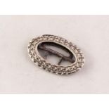 LATE 18th CENTURY IRISH SILVER OVAL BUCKLE with two row embossed diaper pattern with steel fittings,