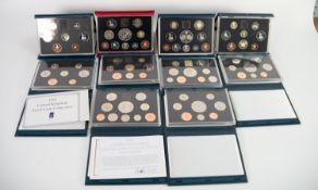 NINE ROYAL MINT ?UNITED KINGDOM PROOF COIN COLLECTIONS? IN HARD BLUE PRESENTATION CASES, three