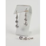 PAIR OF SILVER AND CUBIC ZIRCONIA DROP EARRINGS, each earring with three graduated stones, each