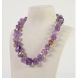 SINGLE STRAND NECKLACE OF GRADUATED FACETED AMETHYST BEADS with silver trigger clasp, 18in (45.