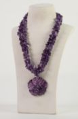 THREE STRAND CHIP AMETHYST BEAD NECKLACE with large purple stained carved mother of pearl and chip