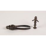 ANTIQUE BRONZE NAKED ELF PIPE TAMPER, arms spread wide  and on a waisted socle, 3 1/4" (8.2cm)