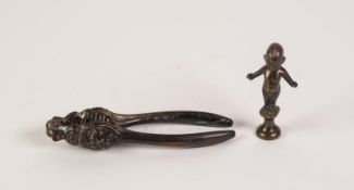 ANTIQUE BRONZE NAKED ELF PIPE TAMPER, arms spread wide  and on a waisted socle, 3 1/4" (8.2cm)