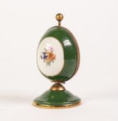 TWENTIETH CENTURY LIMOGES CHINA AND GILT METAL EGG SHAPED SCENT BOTTLE HOLDER, green with floral