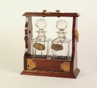 POST WAR MAHOGANY AND BRASS MOUNTED TWO BOTTLE TANTALUS, with locking hinged fall front panel,