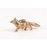 9ct HOLLOW CAST GOLD FOX PATTERN FOB OR CHARM, marked and tests as 9ct gold, 1 3/16" (3cm) long with