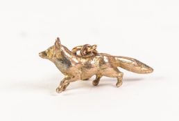 9ct HOLLOW CAST GOLD FOX PATTERN FOB OR CHARM, marked and tests as 9ct gold, 1 3/16" (3cm) long with