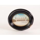 EARLY TWENTIETH CENTURY INDIAN OVAL MINIATURE OF A PALACE AND COURTYARD, with arched front to main