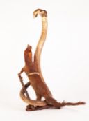 TAXIDERMIC SPECIMEN OF A MONGOOSE ATTACKING A REARING COBRA, 23" (58.5cm) high (a.f.)