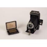 KODAK SIX-20 BELLOWS FOLDING 'BROWNIE' ROLL FILM CAMERA withy 'Dakon' shutter, in brown leather