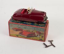 SCHUCO BOXED RADIO 4012 CLOCKWORK TINPLATE TWO SEATER CAR, maroon with red interior, lacks metal