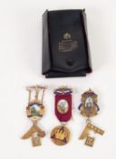 THREE SILVER AND ENAMELLED MASONIC BADGES with ribbons, in a Toye & Kenning plastic folder
