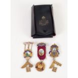 THREE SILVER AND ENAMELLED MASONIC BADGES with ribbons, in a Toye & Kenning plastic folder