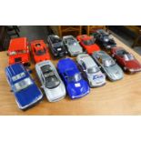 TWELVE APPROXIMATELY 1:18 SCALE DIE CAST MODELS OF LATE 20th CENTURY CARS AND MPVs, makers include