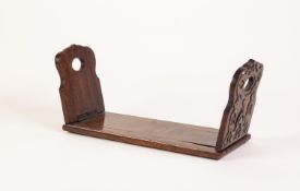 LATE VICTORIAN ROSEWOOD SLIDING AND FOLDING BOOK RACK, applied with Gothic pierced and engraved