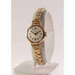 LADY'S LANCO 9ct GOLD CASED SWISS WRISTWATCH wiht 15 jewels movement, white arabic dial, with