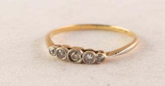 18ct GOLD AND PLATINUM RING collet set with a row of small old cut diamonds graduating from the