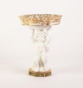 LATE NINETEENTH CENTURY WHITE GLAZED FIGURAL CHINA COMPORT, modelled as a seated Bacchanalian cherub