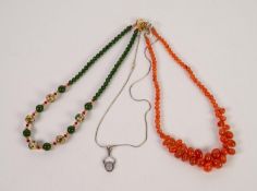 NECKLACE OF TRANSLUSCENT ORANGE HARDSTONE BEADS, 18in (46cm) long; a NECKLACE of green hardstone,