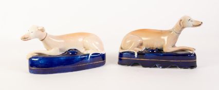 TWO NINETEENTH CENTURY STAFFORDSHIRE POTTERY GREYHOUND INK STANDS, each painted in colours with a