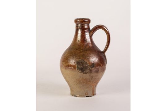 AN EIGHTEENTH CENTURY PROBABLY RHENISH SALT GLAZED STONEWARE JUG, the neck grooved for tying a - Image 2 of 2