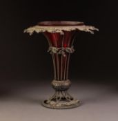VICTORIAN CRANBERRY GLASS TRUMPET VASE IN A PIERCED ELECTROPLATED HOLDER, the wire pattern holder