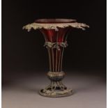 VICTORIAN CRANBERRY GLASS TRUMPET VASE IN A PIERCED ELECTROPLATED HOLDER, the wire pattern holder