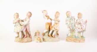 THREE TINTED BISQUE GROUPS OF CHILDREN PLAYING, unmarked, 12? (30.5cm) high and smaller, together