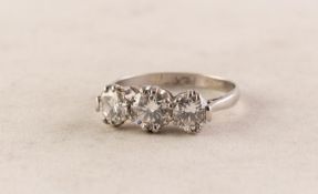 PLATINUM THREE STONE DIAMOND SET RING, the centre stone approximately 0.40 ct and two slightly