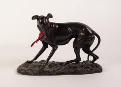 PATINATED SPELTER MODEL OF A GREYHOUND Modelled standing, looking down to the left at a lizard On