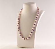 SINGLE STRAND NECKLACE OF UNIFORM CULTURED PEARLS, with chip amethyst spacers, 18in (45.7cm) long